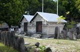 The Hukuru Miskiiy (Friday Mosque) is the most important mosque in the Maldives. Originially constructed c.1153 at the time of the conversion to Islam on the orders of Sultan Muhammad al-Adil, it was restored in 1338, and subsequently renewed and enlarged in 1656-7 by Sultan Ibrahim Iskandar I (1648-87).<br/><br/>

The building is of finely-carved hiri-ga coral, and bears some mouldings of distinctly Buddhist artistic inspiration on the basement. The portico was erected by Ibrahim Iskandar I on his return from the hajj pilgrimage to Mecca in 1668. The distinctive, lighthouse-shaped munnaru (minaret) was erected by the same sultan in 1674-5.<br/><br/>

Asia's smallest and least-known nation, the Republic of Maldives, lies scattered from north to south across a 750-kilometre sweep of the Indian Ocean 500 kilometres south-west of Sri Lanka. More than 1000 islands, together with innumerable banks and reefs, are grouped in a chain of nineteen atolls which extends from a point due west of Colombo to just south of the equator.<br/><br/>

The atolls, formed of great rings of coral based on the submarine Laccadive-Chagos ridge, vary greatly in size. Some are only a few kilometres square, but in the far south the great atoll of Suvadiva is sixty-five kilometres across, and has a central lagoon of more than 2000 square kilometres. The northern and central atolls are separated from each other by comparatively narrow channels of deep water, but in the south Suvadiva is cut off by the eighty-kilometre-wide One-and-a-half-Degree Channel. Addu Atoll is still more isolated, being separated from the atoll of Suvadiva by the seventy-kilometre-wide Equatorial Channel.