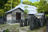 The Hukuru Miskiiy (Friday Mosque) is the most important mosque in the Maldives. Originially constructed c.1153 at the time of the conversion to Islam on the orders of Sultan Muhammad al-Adil, it was restored in 1338, and subsequently renewed and enlarged in 1656-7 by Sultan Ibrahim Iskandar I (1648-87).<br/><br/>

The building is of finely-carved hiri-ga coral, and bears some mouldings of distinctly Buddhist artistic inspiration on the basement. The portico was erected by Ibrahim Iskandar I on his return from the hajj pilgrimage to Mecca in 1668. The distinctive, lighthouse-shaped munnaru (minaret) was erected by the same sultan in 1674-5.<br/><br/>

Asia's smallest and least-known nation, the Republic of Maldives, lies scattered from north to south across a 750-kilometre sweep of the Indian Ocean 500 kilometres south-west of Sri Lanka. More than 1000 islands, together with innumerable banks and reefs, are grouped in a chain of nineteen atolls which extends from a point due west of Colombo to just south of the equator.<br/><br/>

The atolls, formed of great rings of coral based on the submarine Laccadive-Chagos ridge, vary greatly in size. Some are only a few kilometres square, but in the far south the great atoll of Suvadiva is sixty-five kilometres across, and has a central lagoon of more than 2000 square kilometres. The northern and central atolls are separated from each other by comparatively narrow channels of deep water, but in the south Suvadiva is cut off by the eighty-kilometre-wide One-and-a-half-Degree Channel. Addu Atoll is still more isolated, being separated from the atoll of Suvadiva by the seventy-kilometre-wide Equatorial Channel.