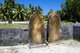 In the Maldives, being a Muslim country, people are buried. Tombstones with a single point on the top are those of men, while those  with a rounded top are those of women.<br/><br/>

Asia's smallest and least-known nation, the Republic of Maldives, lies scattered from north to south across a 750-kilometre sweep of the Indian Ocean 500 kilometres south-west of Sri Lanka. More than 1000 islands, together with innumerable banks and reefs, are grouped in a chain of nineteen atolls which extends from a point due west of Colombo to just south of the equator.<br/><br/>

The atolls, formed of great rings of coral based on the submarine Laccadive-Chagos ridge, vary greatly in size. Some are only a few kilometres square, but in the far south the great atoll of Suvadiva is sixty-five kilometres across, and has a central lagoon of more than 2000 square kilometres. The northern and central atolls are separated from each other by comparatively narrow channels of deep water, but in the south Suvadiva is cut off by the eighty-kilometre-wide One-and-a-half-Degree Channel. Addu Atoll is still more isolated, being separated from the atoll of Suvadiva by the seventy-kilometre-wide Equatorial Channel.